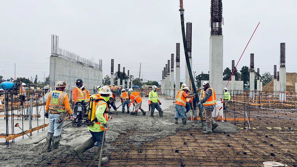 Workers pour the first slab-on-grade at the Quick Turn Around Facility.