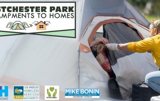 Person talking to homeless person in a tent