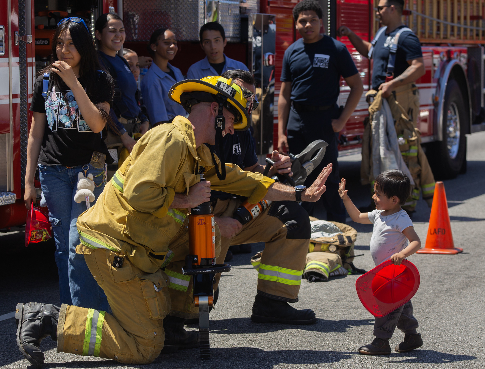 Fireman High fives a little boy